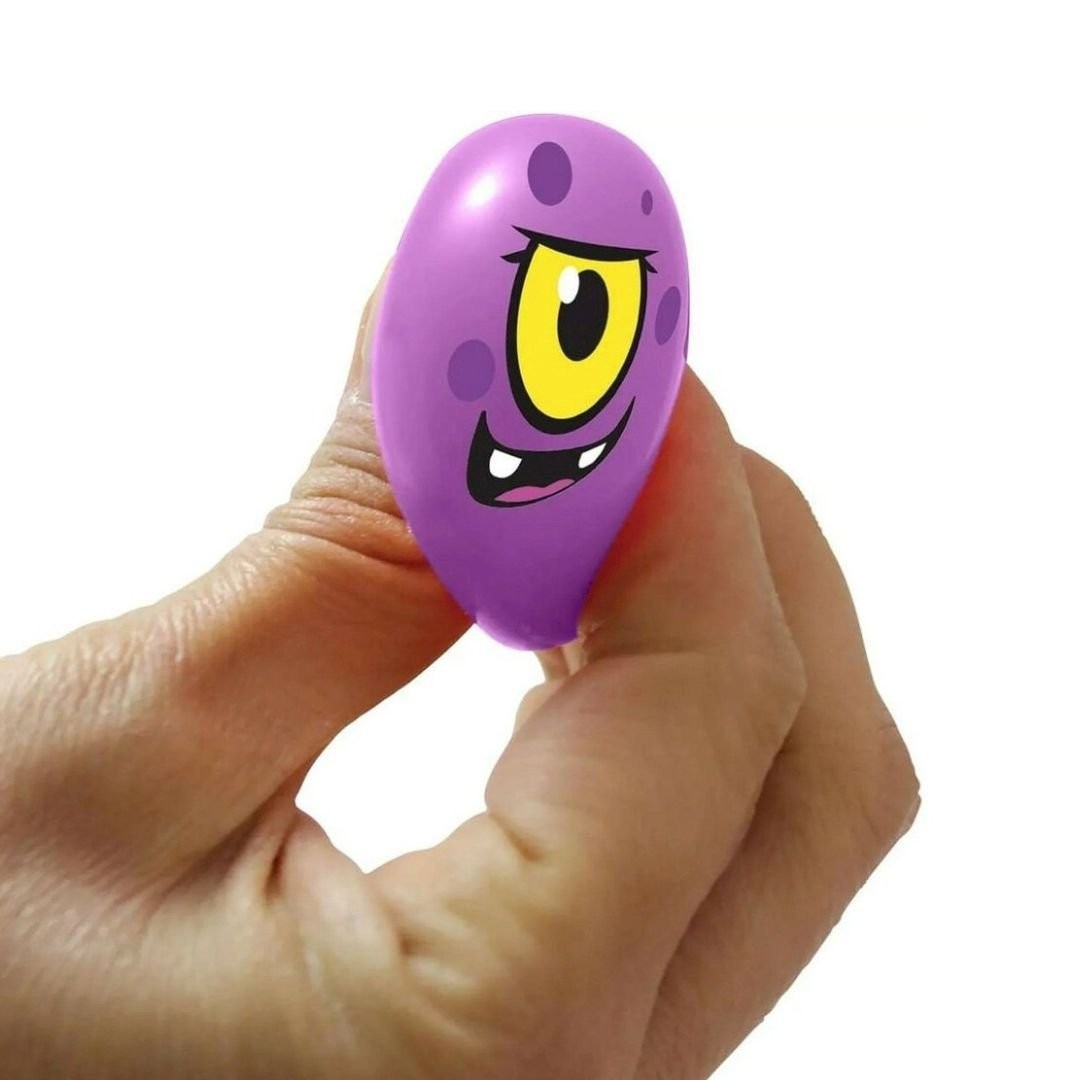 Hand squishing the purple Monster Mush NeeDoh Spooky Squishkins ball